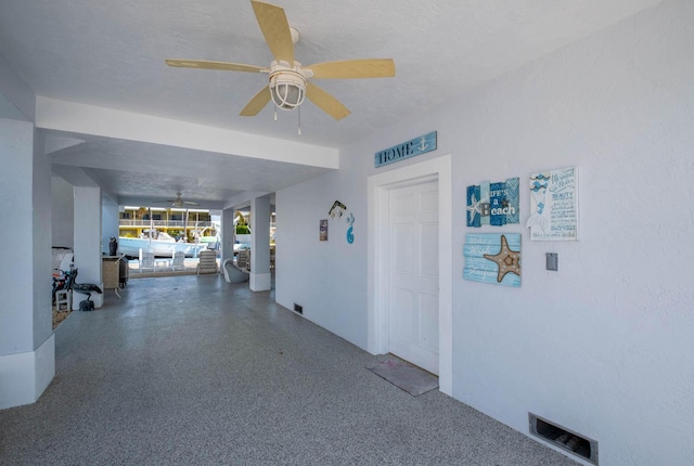 interior space featuring visible vents and a textured ceiling