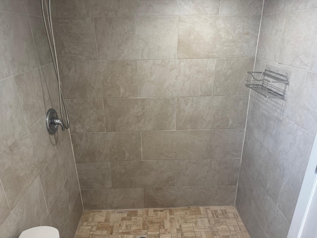 bathroom with a tile shower