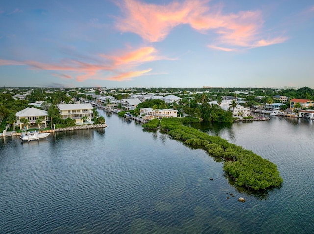 aerial view at dusk with a water view