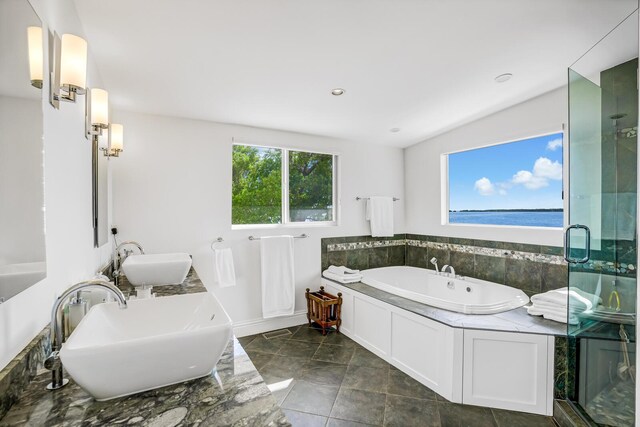 bathroom with vanity and a tub