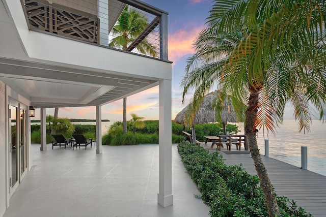 patio terrace at dusk with a water view