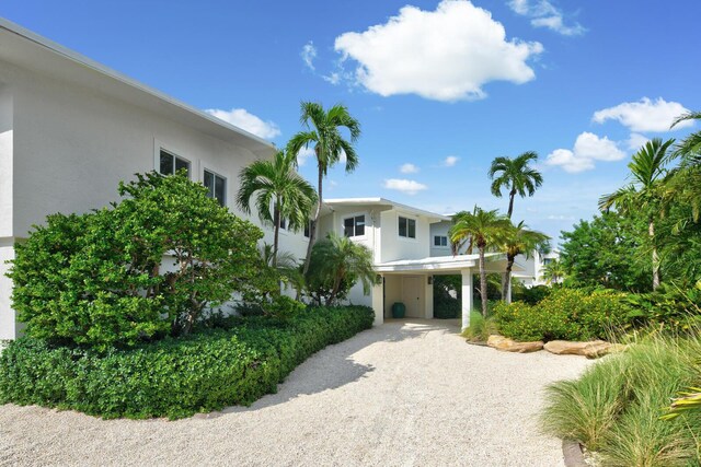 view of front facade with a carport