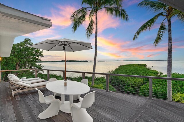 deck at dusk with a water view