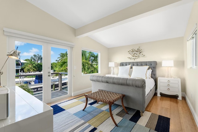 bedroom with multiple windows, vaulted ceiling with beams, access to exterior, and light hardwood / wood-style flooring