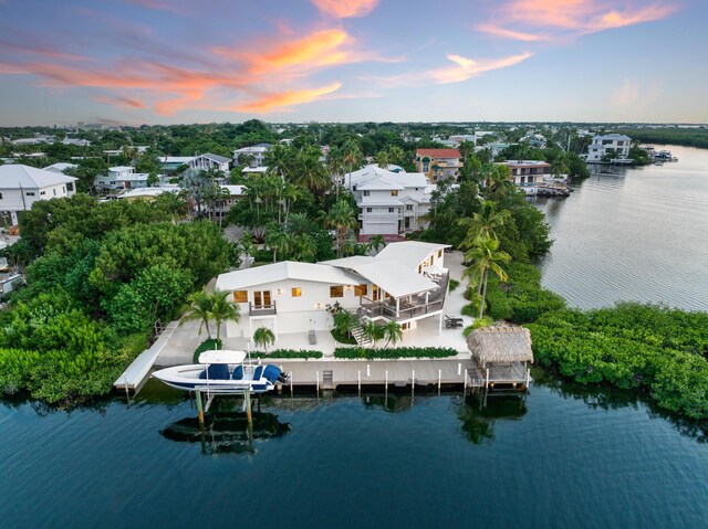 aerial view at dusk with a water view