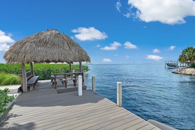 view of dock with a water view and a gazebo