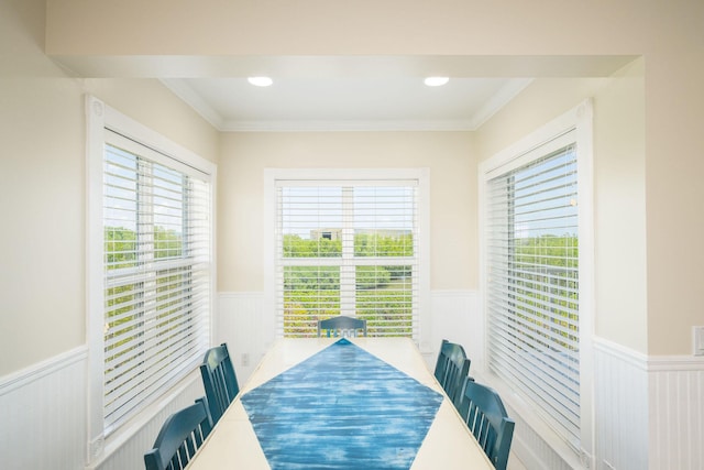 5960 Peninsular Ave Unit 101, Stock Island, FL 33040 - dining area featuring a wainscoted wall, plenty of natural light, ornamental molding, and a decorative wall
