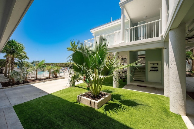 5960 Peninsular Ave Unit 101, Stock Island, FL 33040 - view of green lawn featuring a balcony