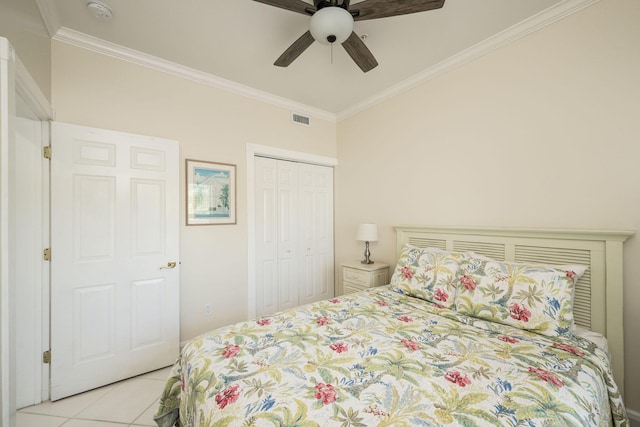 5960 Peninsular Ave Unit 101, Stock Island, FL 33040 - bedroom with ornamental molding, tile patterned floors, a closet, and a ceiling fan