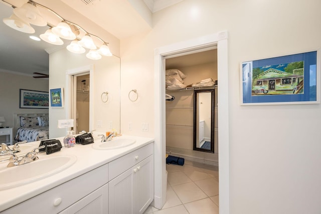 5960 Peninsular Ave Unit 101, Stock Island, FL 33040 - full bath featuring connected bathroom, ornamental molding, tile patterned flooring, and double vanity