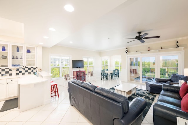 5960 Peninsular Ave Unit 101, Stock Island, FL 33040 - living area with light tile patterned floors, a ceiling fan, recessed lighting, and crown molding