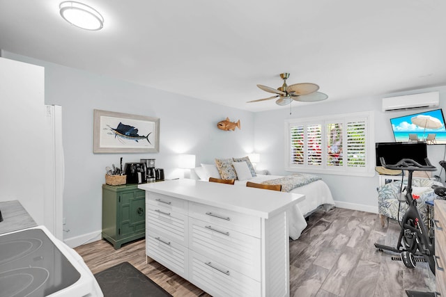 bedroom featuring ceiling fan, a wall mounted AC, and light wood-type flooring