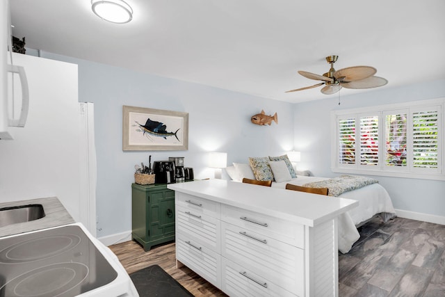 bedroom featuring hardwood / wood-style flooring and ceiling fan