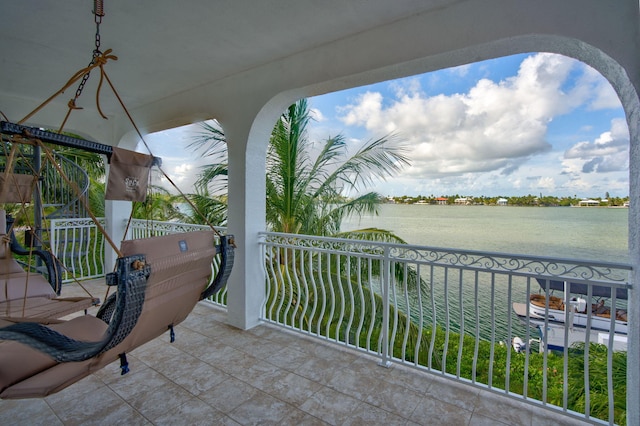 balcony featuring a water view