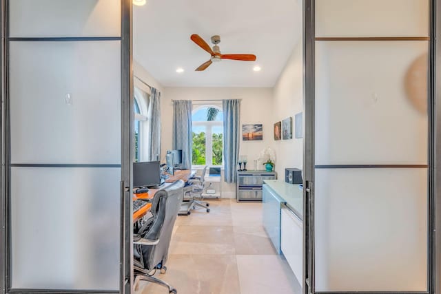 home office with ceiling fan and light tile patterned floors