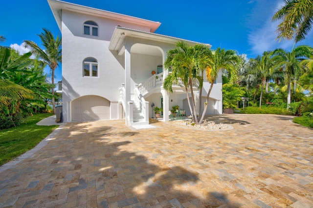 mediterranean / spanish house with a garage