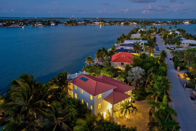 aerial view at dusk with a water view