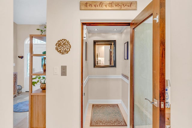 hallway featuring crown molding