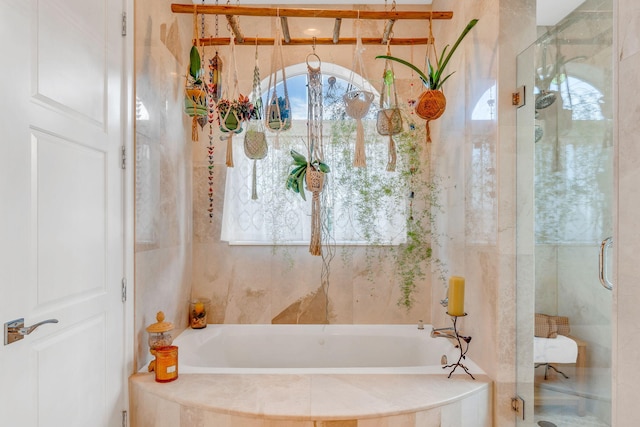 bathroom with plus walk in shower and a wealth of natural light