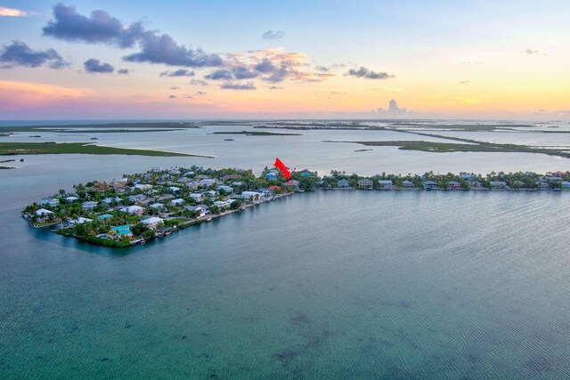 aerial view at dusk with a water view