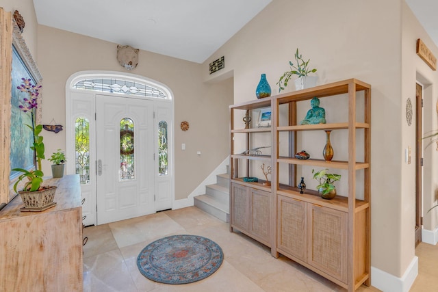 foyer entrance with light tile patterned flooring