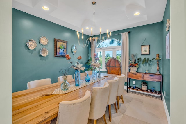 tiled dining space featuring a notable chandelier