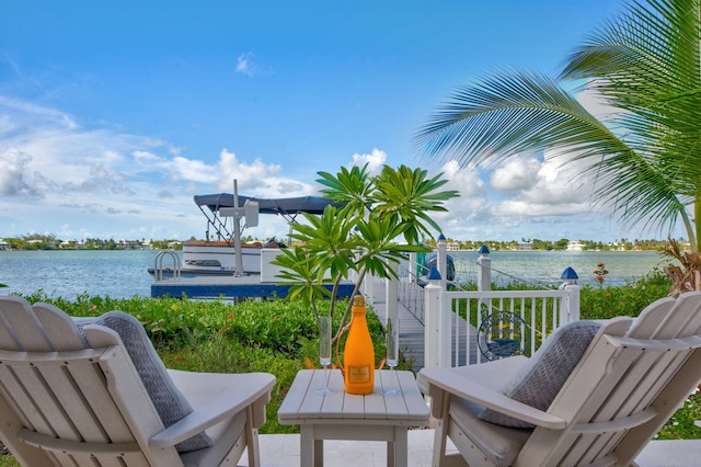 wooden deck featuring a water view