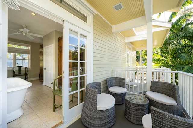 balcony featuring a ceiling fan