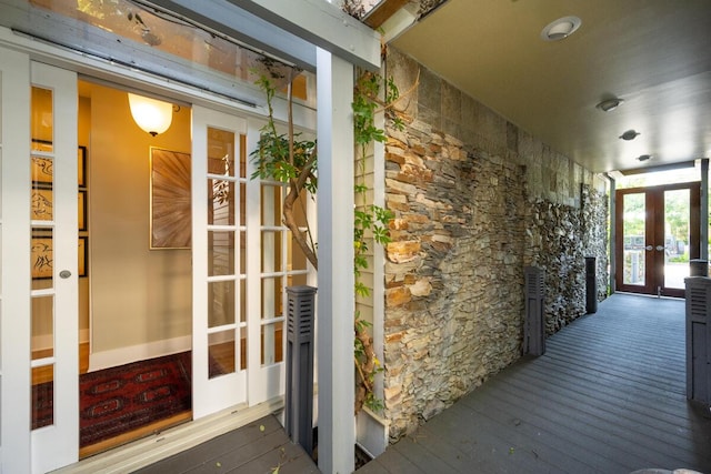 doorway to property with stone siding