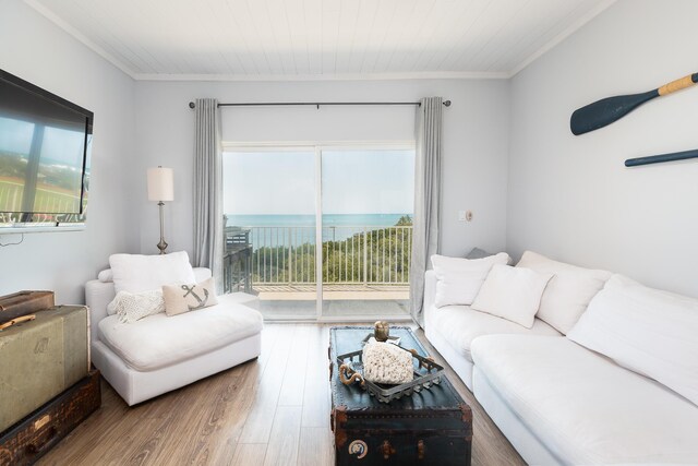 living room featuring a water view, wood ceiling, wood-type flooring, and crown molding