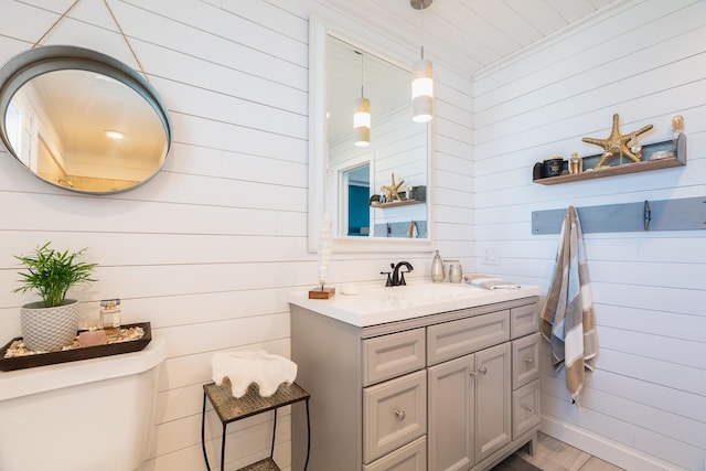 bathroom featuring vanity and toilet