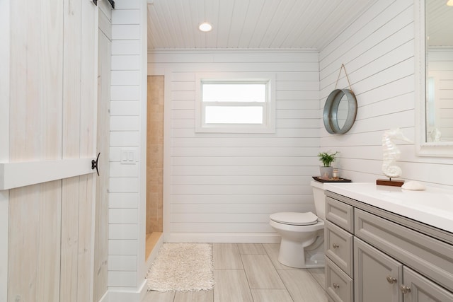 bathroom with vanity, wooden ceiling, walk in shower, and toilet