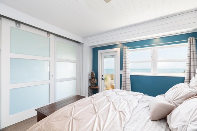 bedroom with wood-type flooring and wooden ceiling