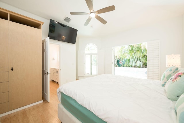 bedroom featuring light wood finished floors, ceiling fan, and visible vents