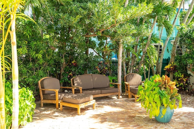 view of patio / terrace with outdoor lounge area and fence