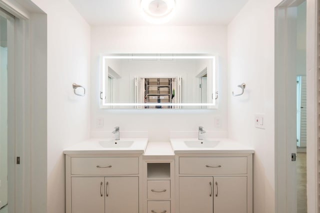 bathroom featuring double vanity and a sink