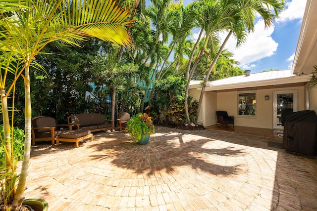 view of patio / terrace featuring outdoor lounge area and a grill