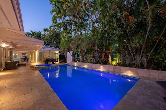 outdoor pool featuring outdoor dining area, an outdoor hangout area, and a patio