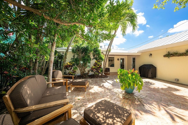 view of patio / terrace with an outdoor hangout area and area for grilling