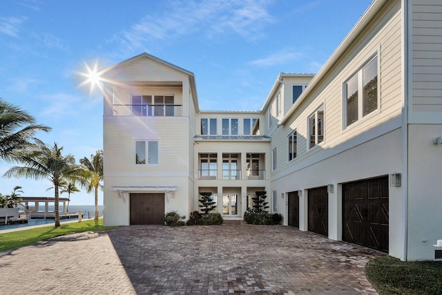 view of front of home featuring a garage and a water view