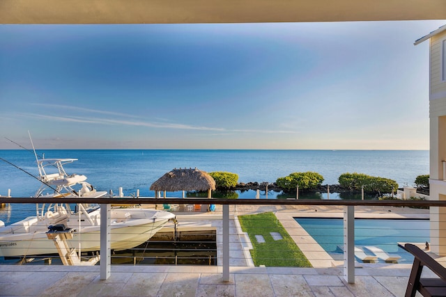 view of swimming pool with a water view