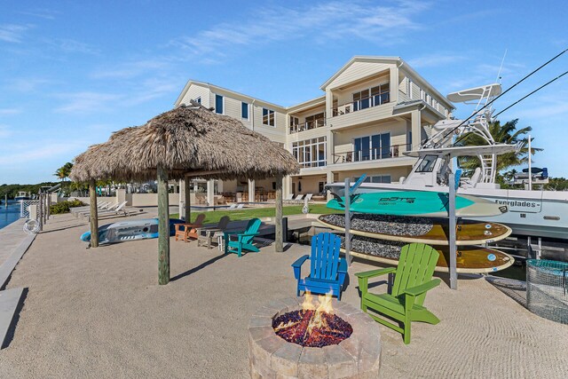 surrounding community featuring a fire pit and a gazebo