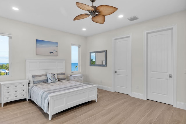 bedroom featuring ceiling fan and light hardwood / wood-style flooring