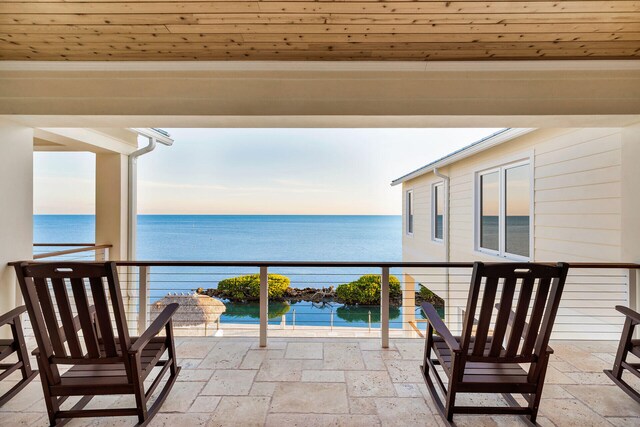 balcony featuring a water view