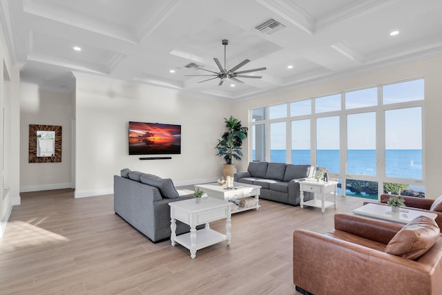 living room featuring beam ceiling, crown molding, ceiling fan, and light wood-type flooring