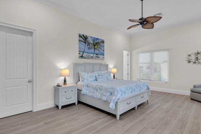 bedroom with crown molding, ceiling fan, and light wood-type flooring