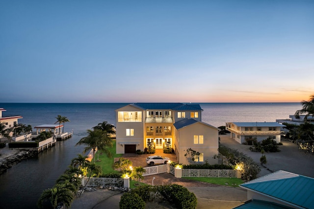 exterior space featuring a water view and a balcony