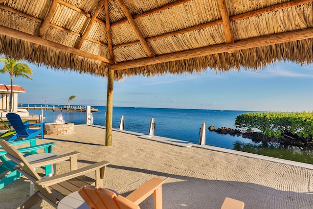 exterior space featuring a gazebo and an outdoor fire pit