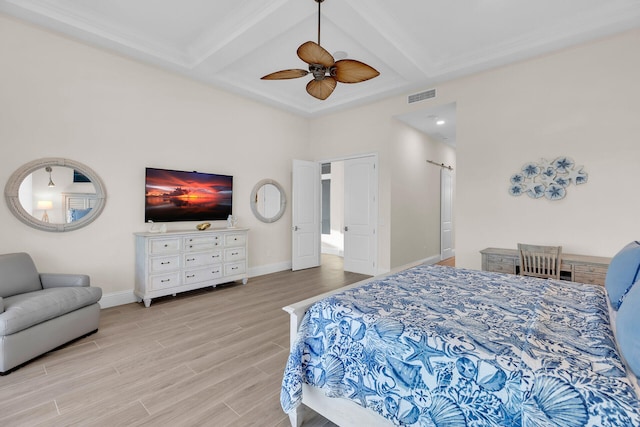 bedroom featuring beamed ceiling, coffered ceiling, and light hardwood / wood-style floors