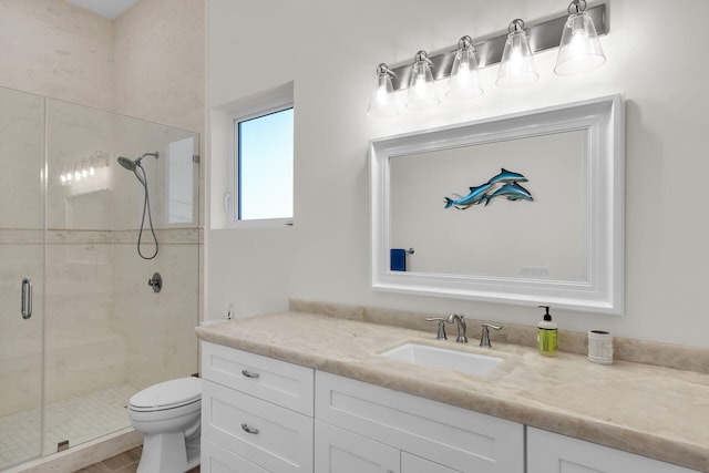 bathroom with vanity, toilet, and an enclosed shower